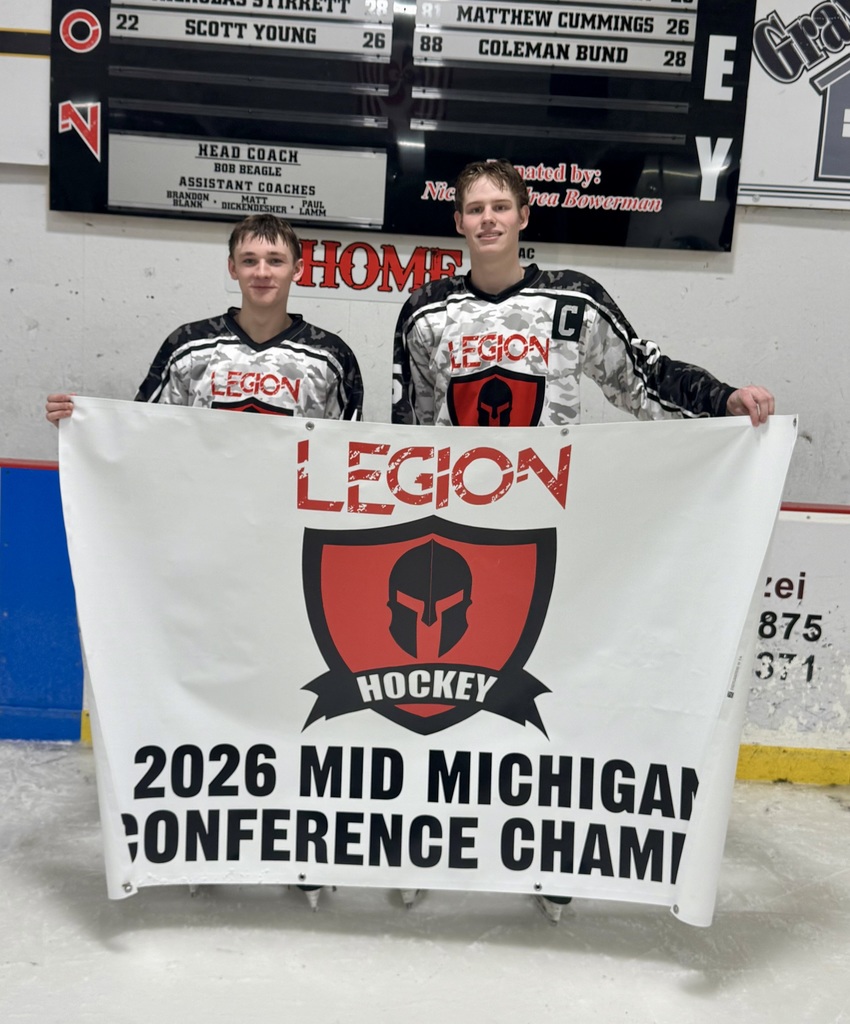 Legion Hockey Team Pictured with Banner. 