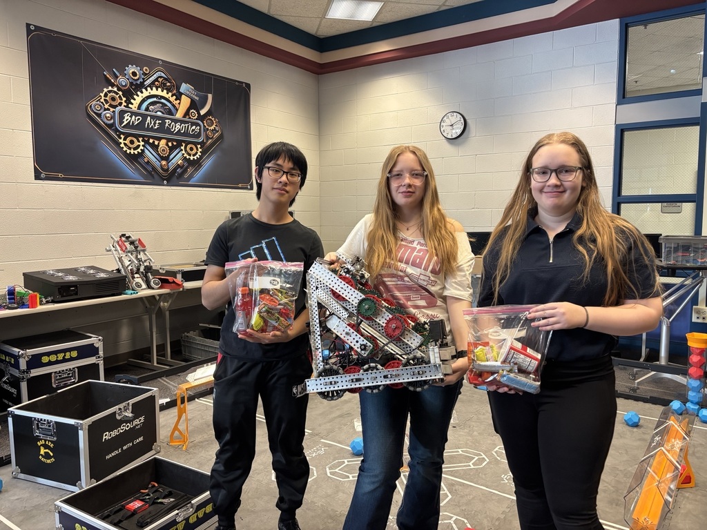 Daniel Ma, Halee Vacekonis, and Jade Vacekonis holding their 2026 robot.