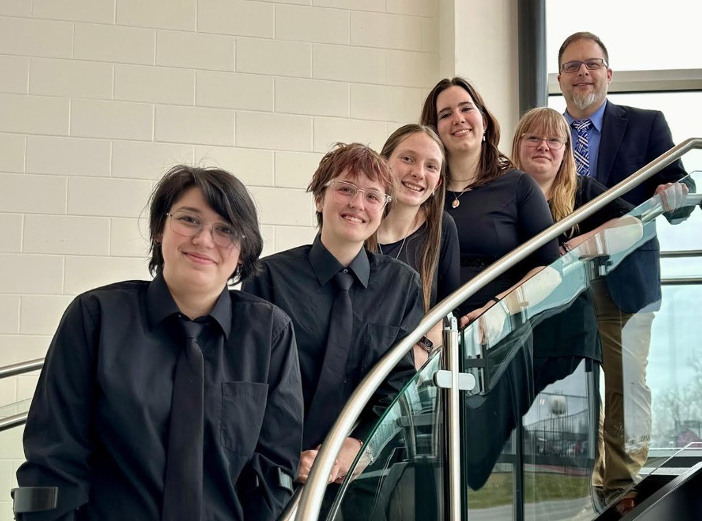 Seniors of the Bad Axe High School Choir pose on the stairs.