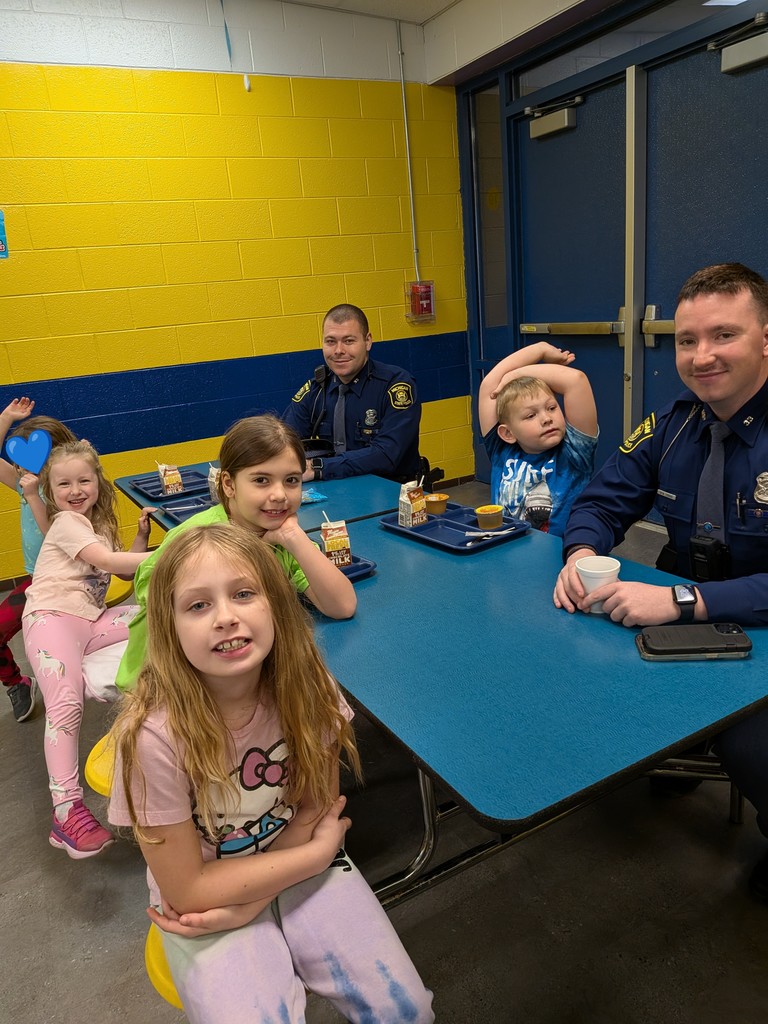 Bad Axe Elementary students enjoy tasty donuts with local cops.