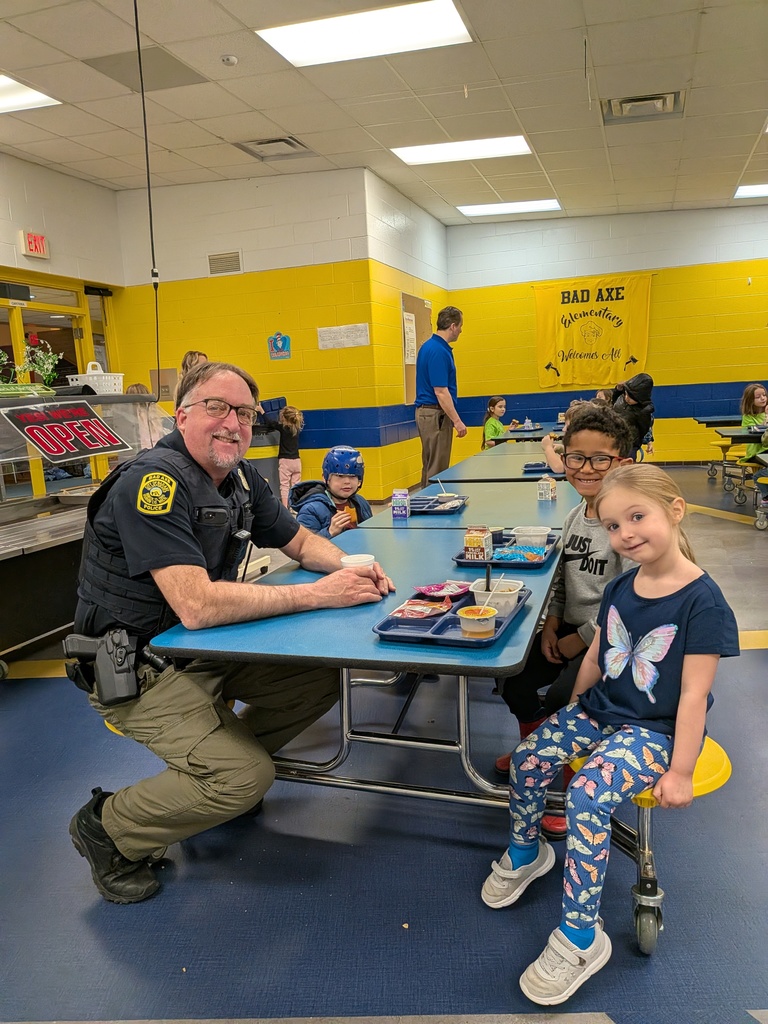 Bad Axe Elementary students enjoy tasty donuts with local cops.
