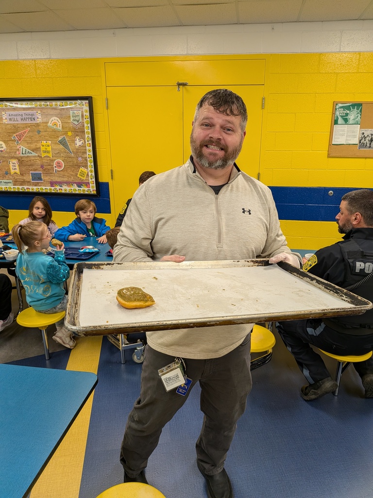 Mr. Clark passes out donuts to our students.