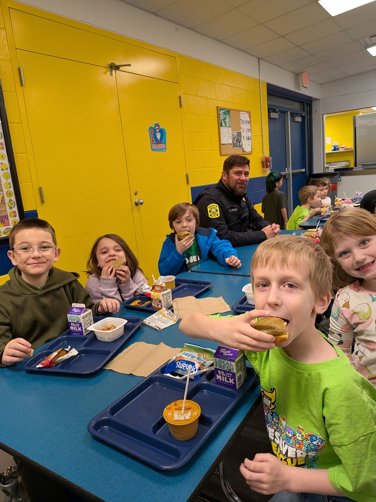 Bad Axe Elementary students enjoy tasty donuts with local cops.