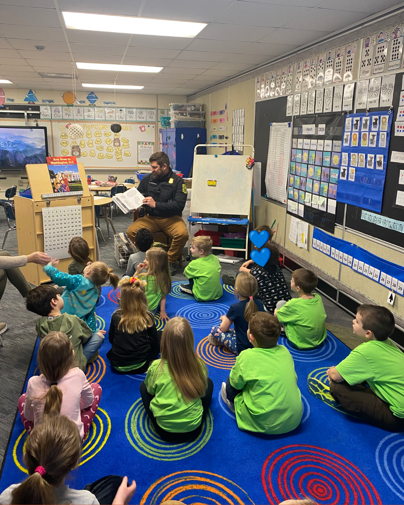 Local Police Officers read to Elementary Hatchets.
