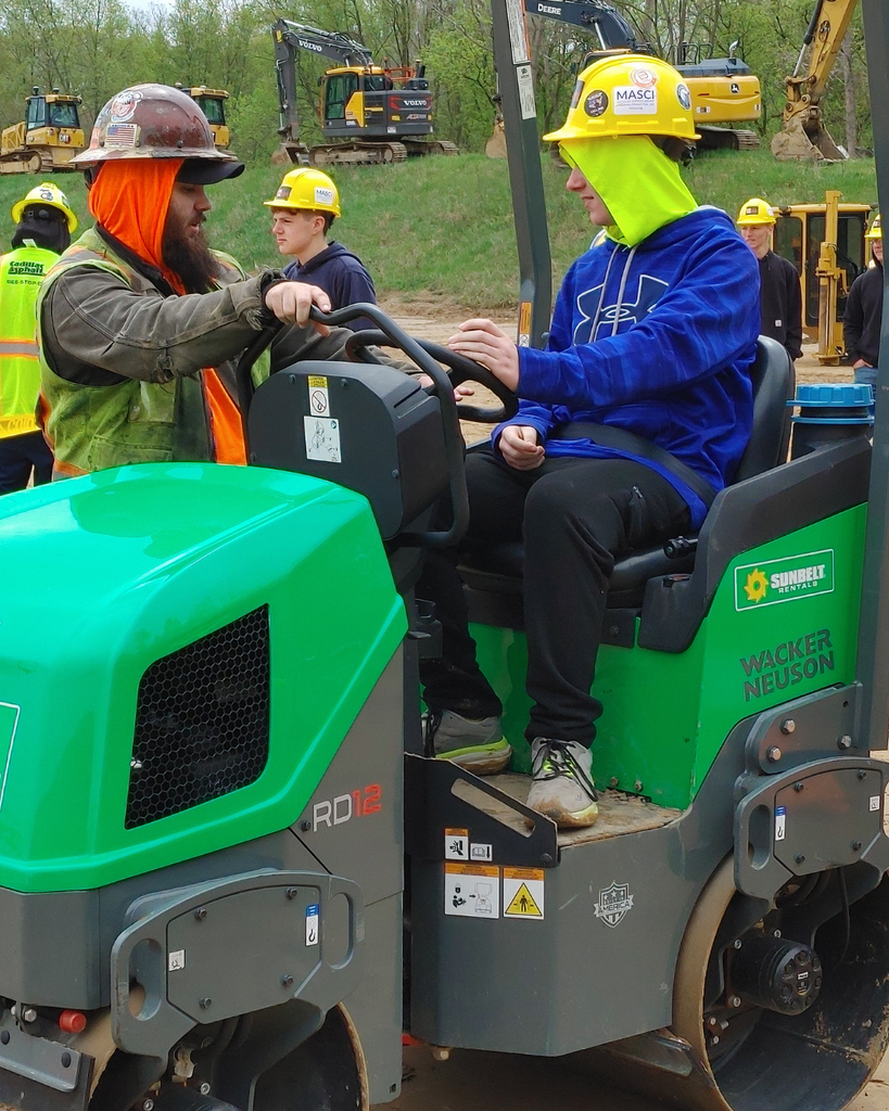 High School Students enjoy exploring heavy machinery at this year's Construction Day. 