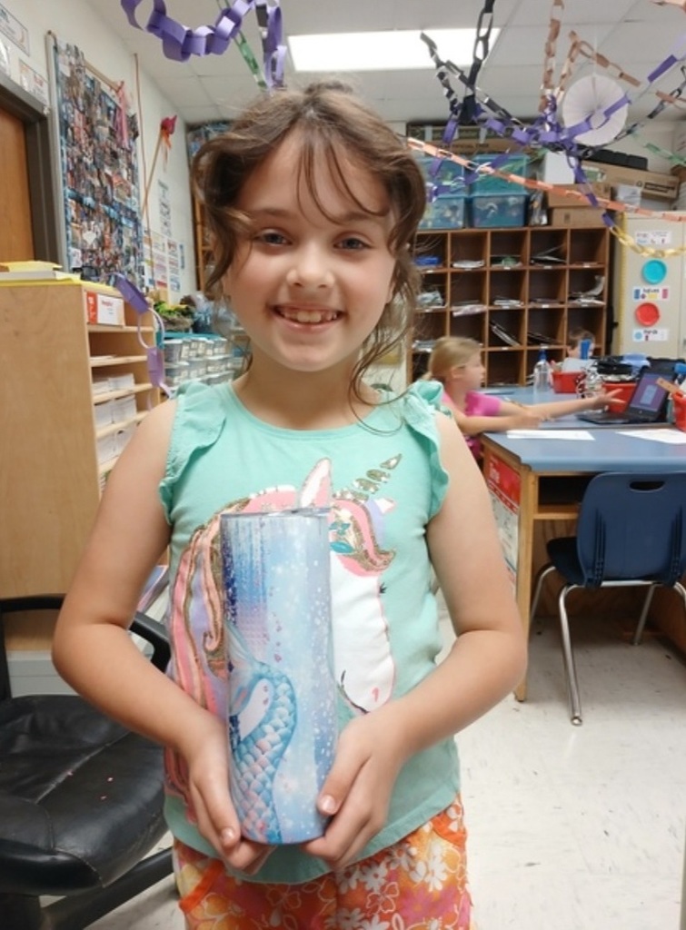RHETTA MCMORROW HOLDING A PRIZE CUP
