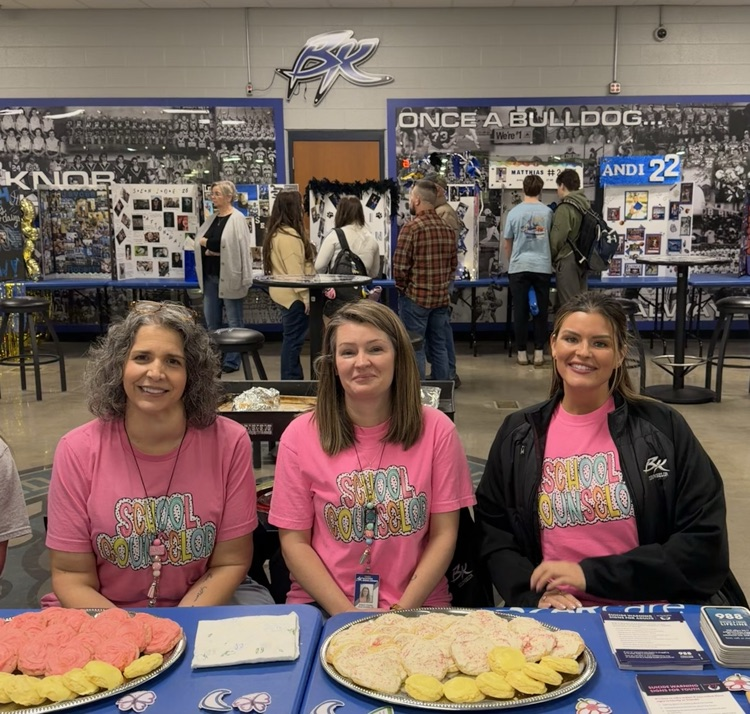 sitting at the table with cookies
