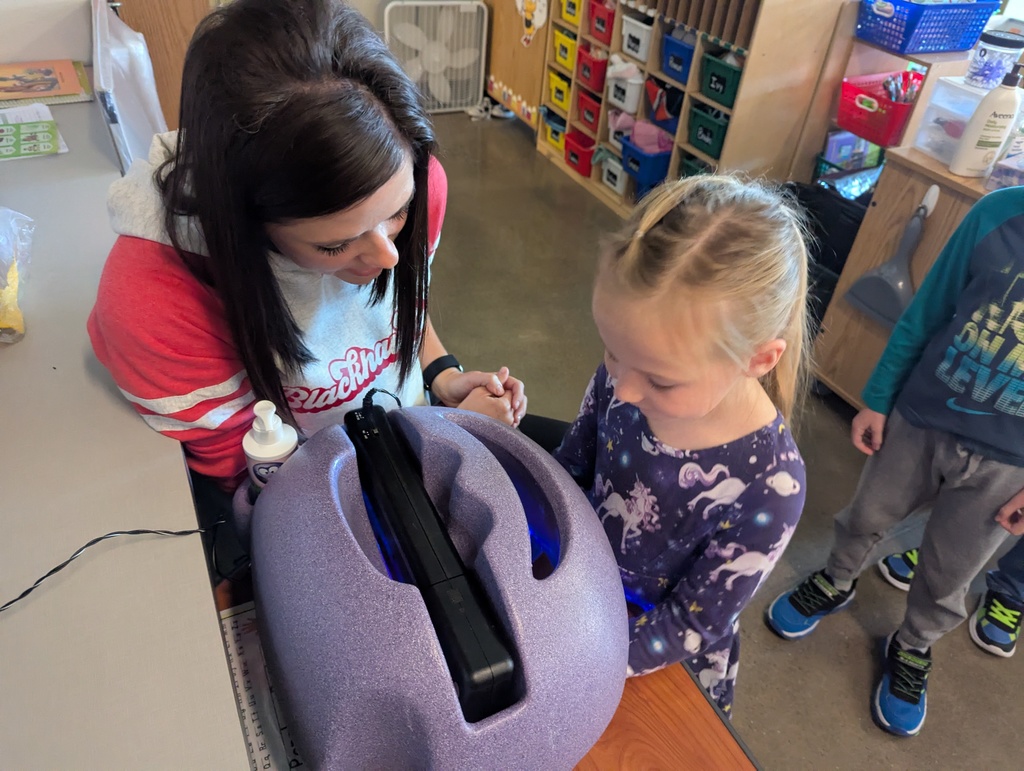 Student and Nurse looking at hands
