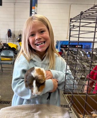 Smiling girl with animal