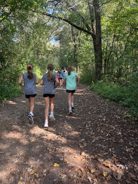 Students running on a trail.