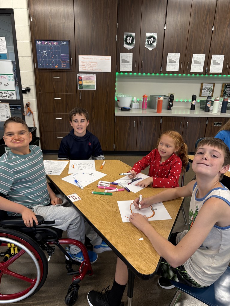 5th graders and kindergartners coloring