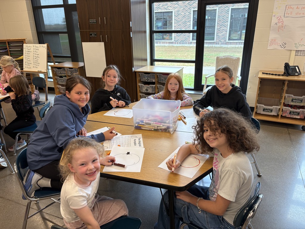 Students at a table coloring