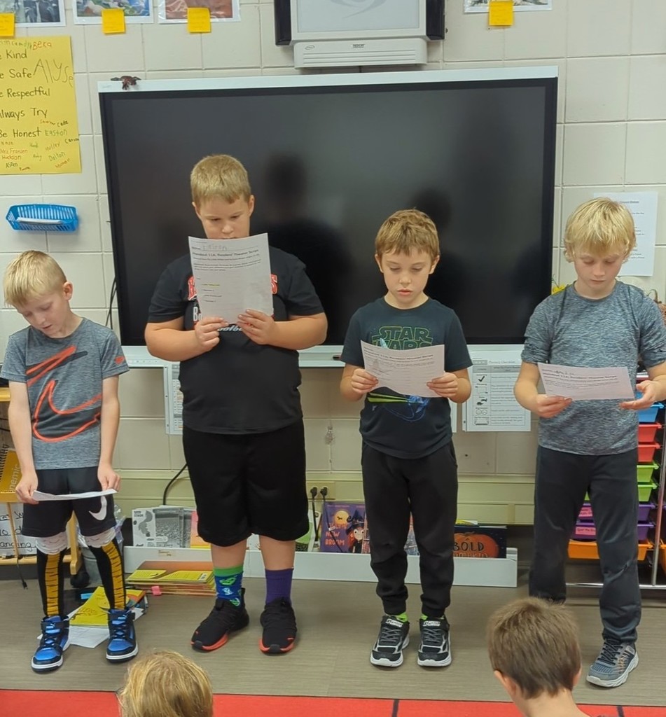 Four boys performing.