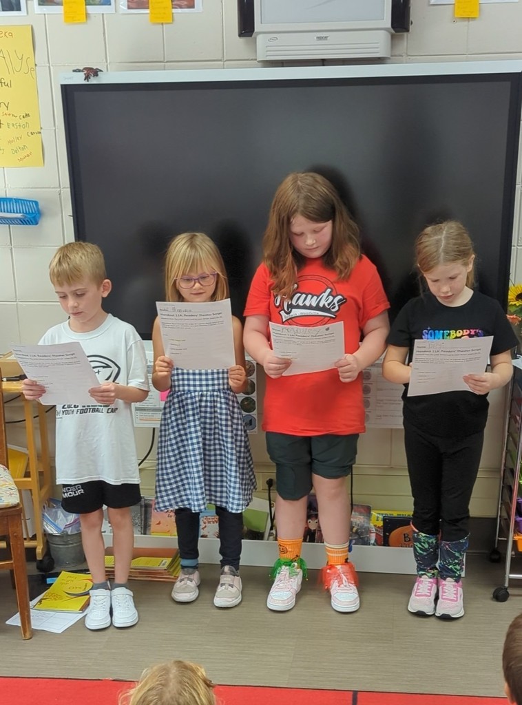 A boy and three girls performing