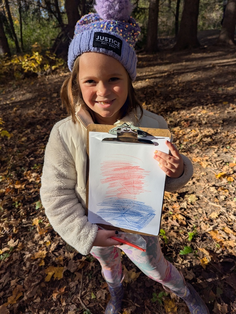 Student with a picture she drew.