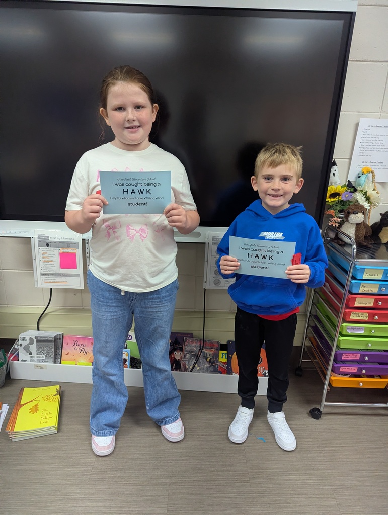 Two happy students with their HAWK tickets.