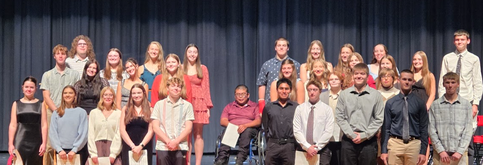 Students on the stage of the Performing Arts Center.