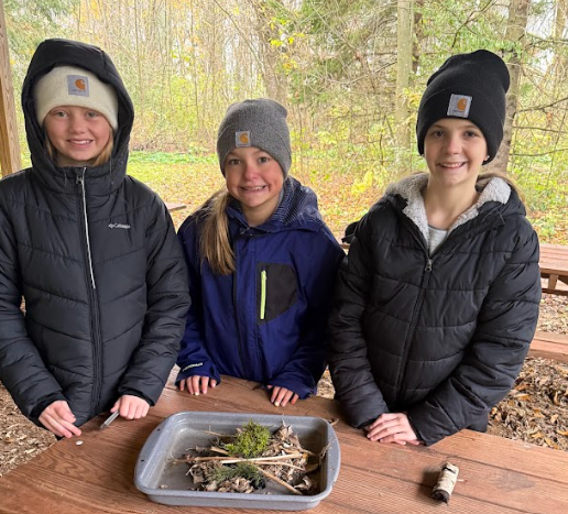 Students practicing survival skills.