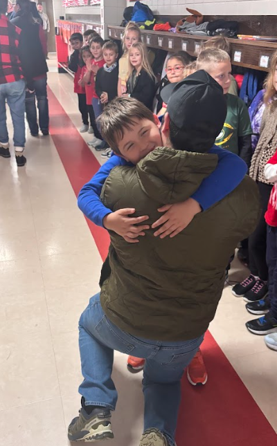 Father and son embracing.