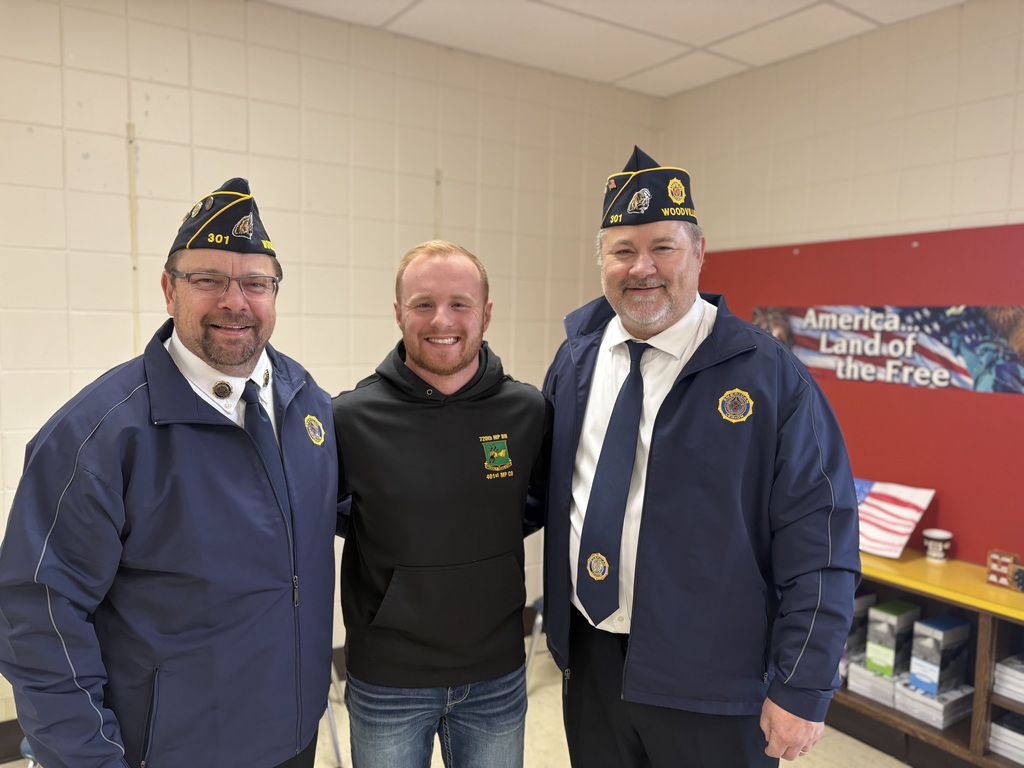 Local veterans smiling for a picture.