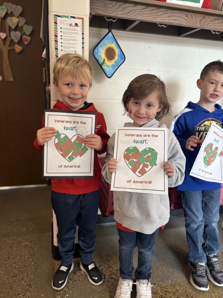 Kindergartners with their artwork.