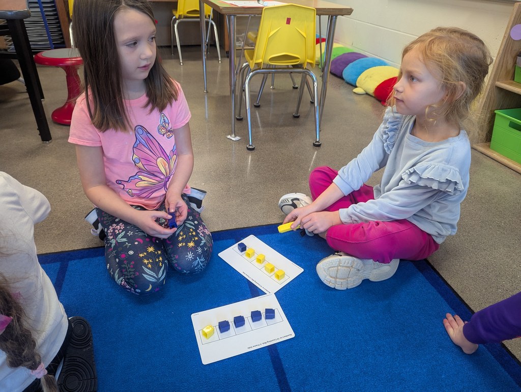 Two students on the carpet