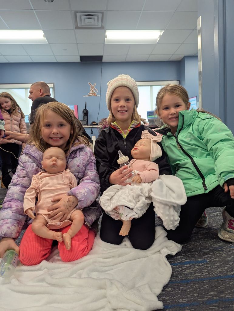 Three smiling students.