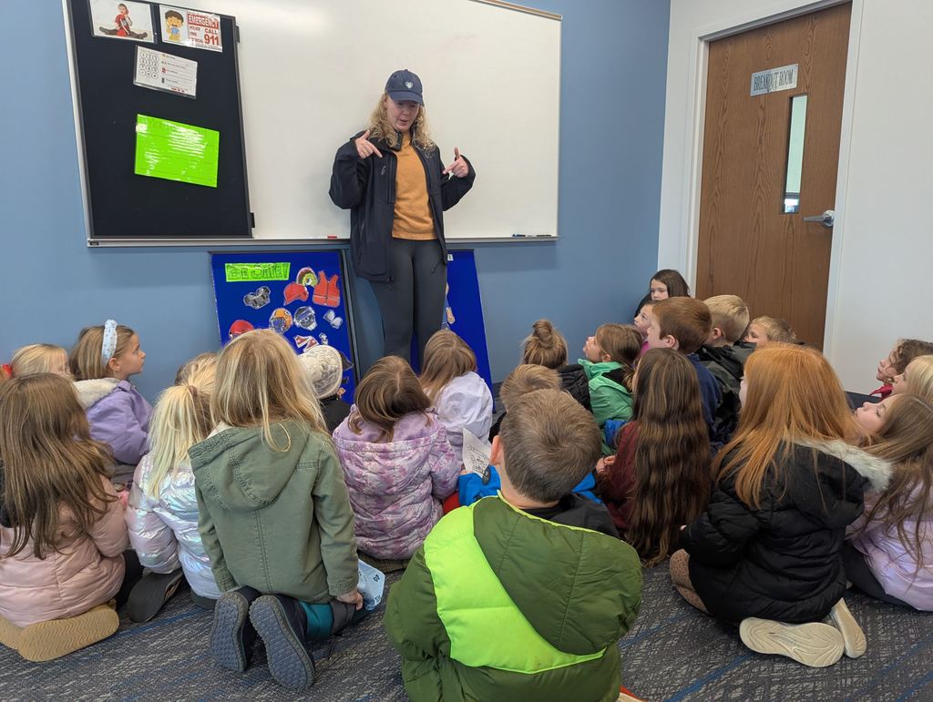 EMS staff member talking with students.