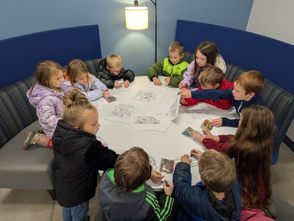 Students coloring at the ambulance garage.