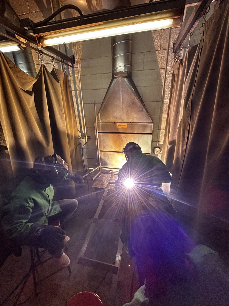 Two students in the welding room.