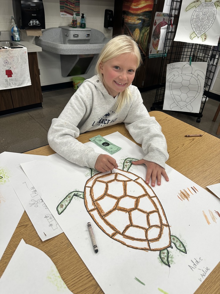 A girl with her sea turtle project.