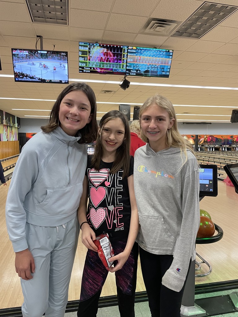 Three girls at the bowling alley.