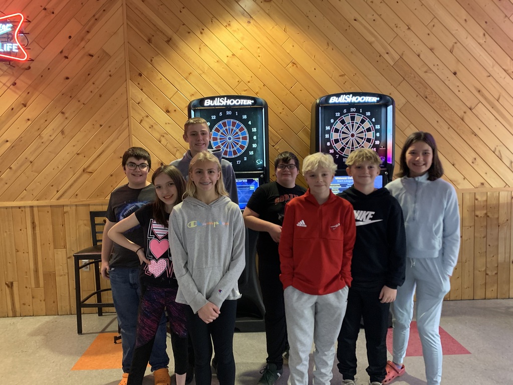 Group picture of eight students at the bowling alley.