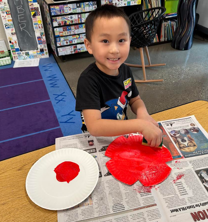 Student painting in art room.