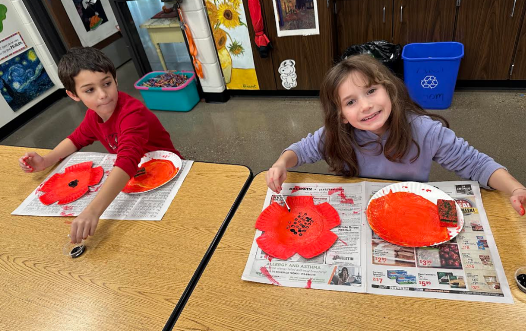 Students in the art room working on the poppy.