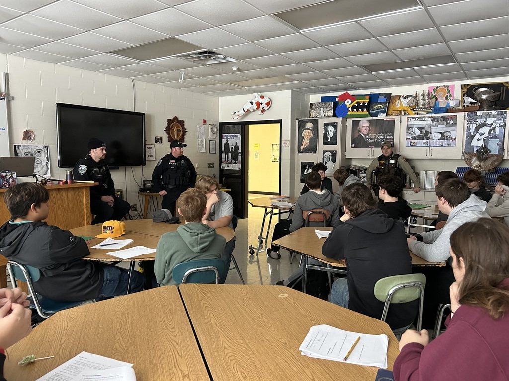 All officers speaking with students.