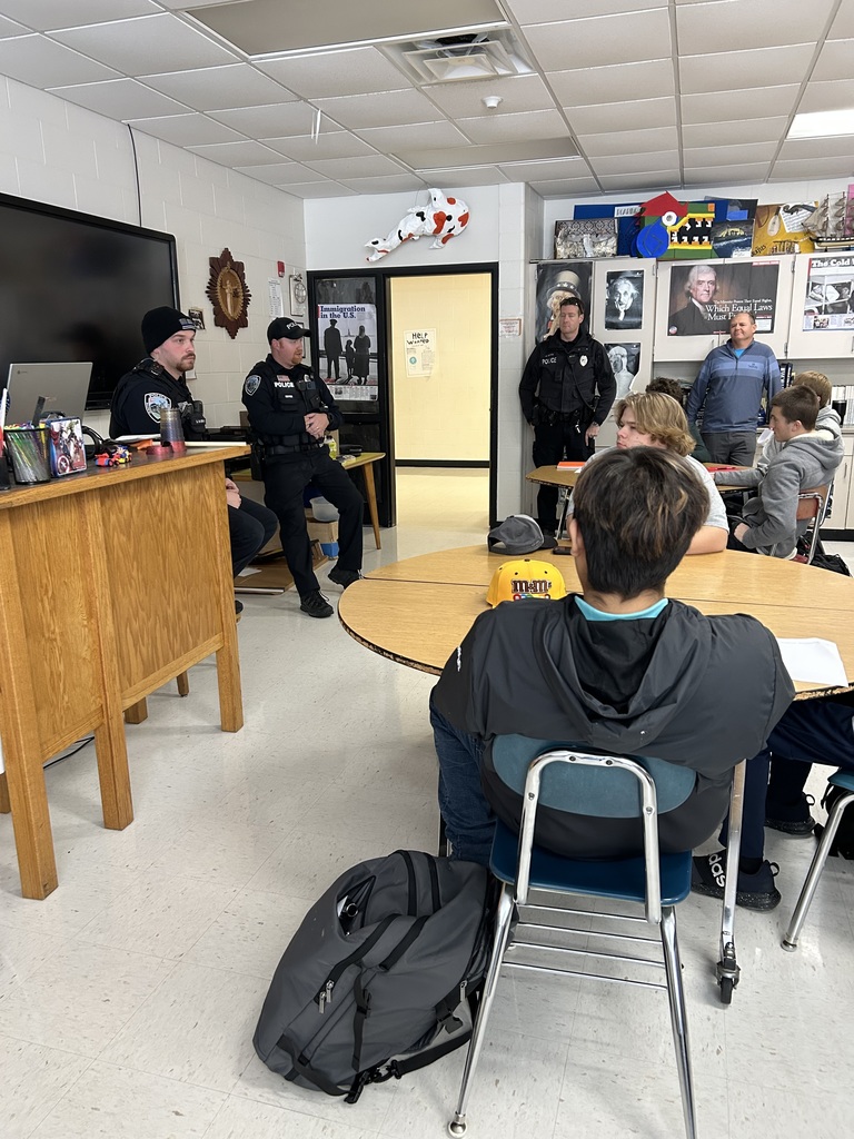 Police Officers and J.R. Dachel talking with students.