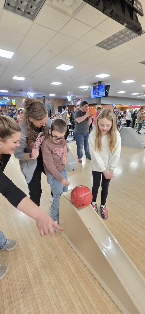Students and staff bowling.