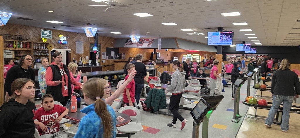 Group picture of students and staff at the bowling alley.