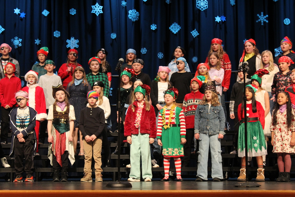 Students on stage singing.