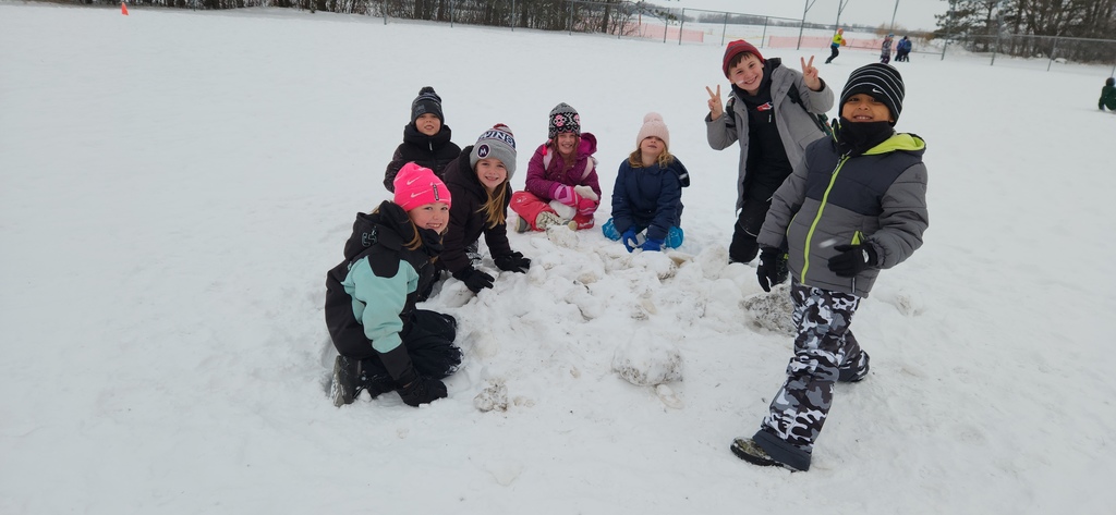 Students building a snow pile.