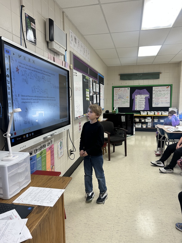 Student presenting his math homework.