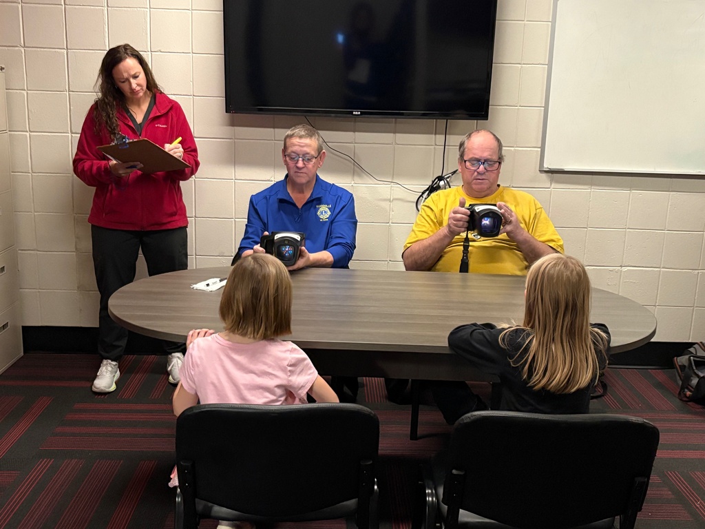 Lions Club members screening students.