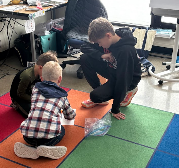 Principal Wolski working with students.