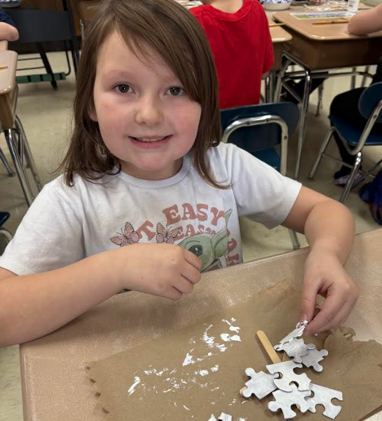 Smiling girl with her ornament.