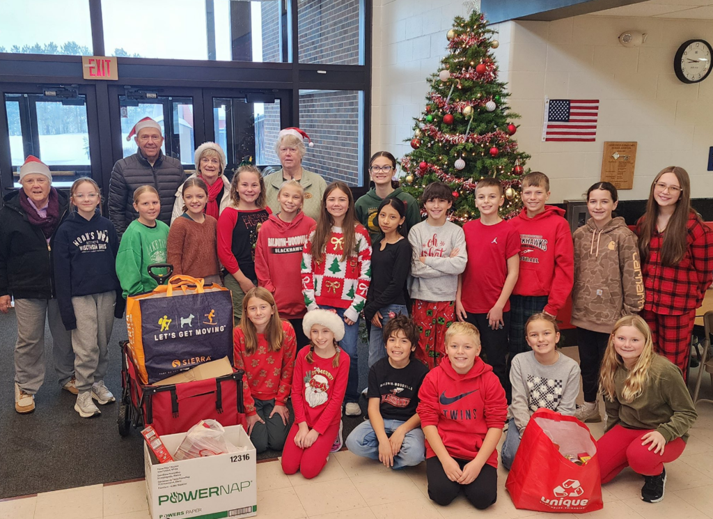 Students with volunteers from the food pantry.