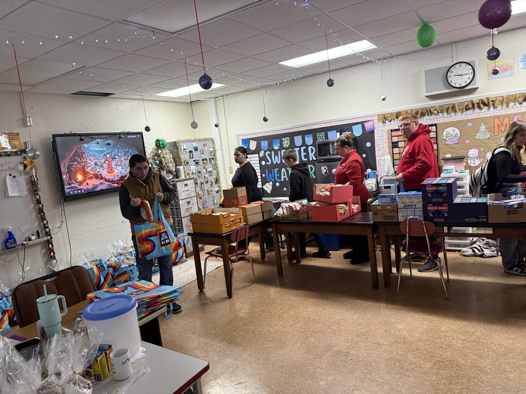 Students putting together bags.