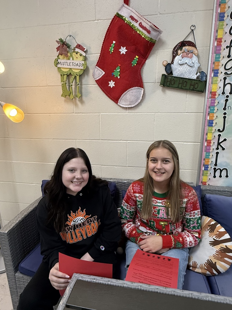 Two students reading on a couch