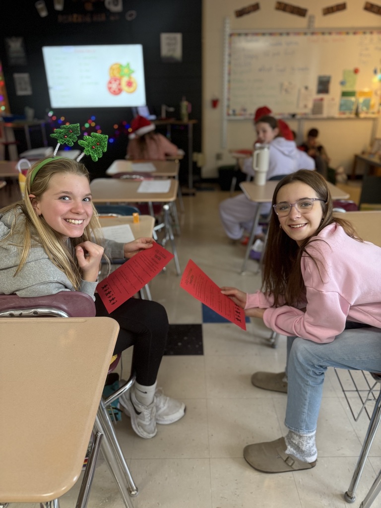 Two girls smiling and posing for a picture.