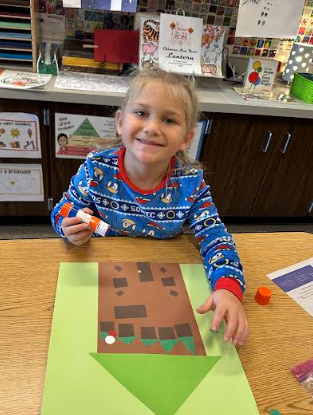 Student using a glue stick.